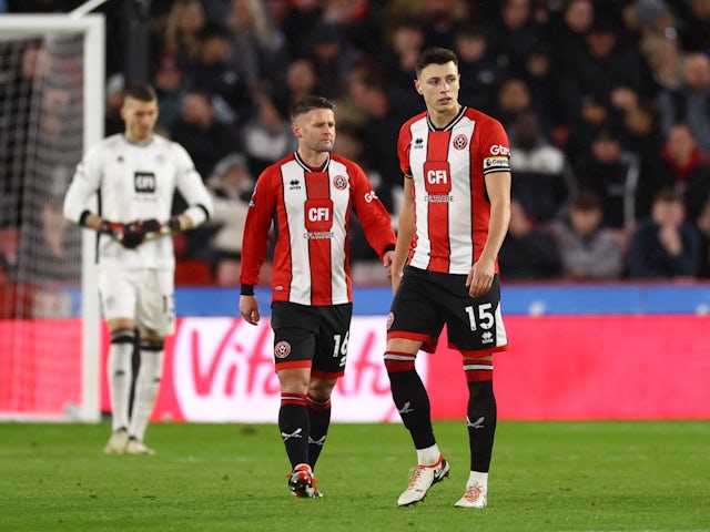 Sheffield United's Oliver Norwood and Anel Ahmedhodzic look dejected after Arsenal's Martin Odegaard scores their first goal on March 4, 2024