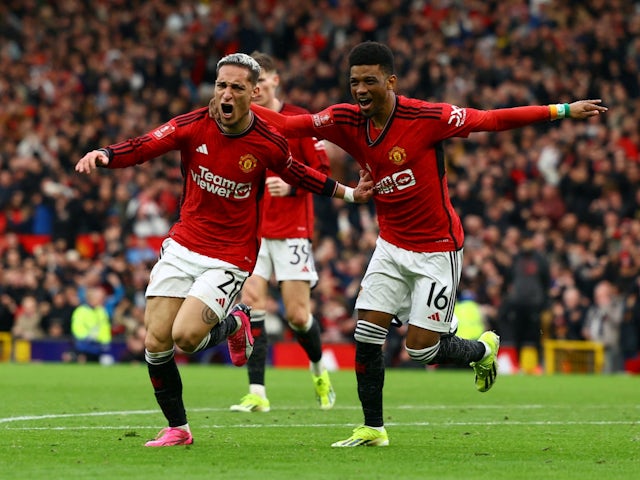 Sports Manchester United's Antony celebrates scoring their 2d arrangement with Amad Diallo on March 17, 2024