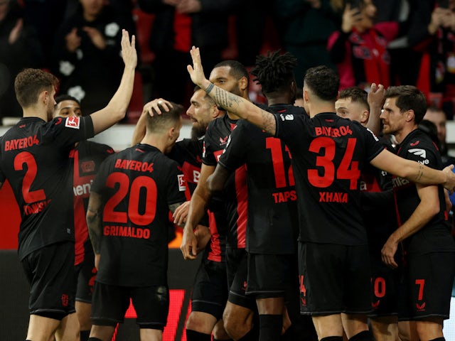 Bayer Leverkusen's Florian Wirtz celebrates scoring their second goal with teammates on March 10, 2024