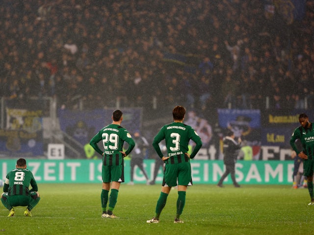 Borussia Monchengladbach's Joe Scally and Ko Itakura look dejected after the match on March 12, 2024