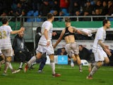 FC Saarbrucken's Kai Brunker celebrates scoring their second goal with teammates on March 12, 2024