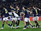 Fenerbahce players celebrate after Dusan Tadic scores their third goal on March 7, 2024