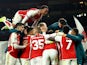 Arsenal's Gabriel with teammates celebrate after the match on March 12, 2024