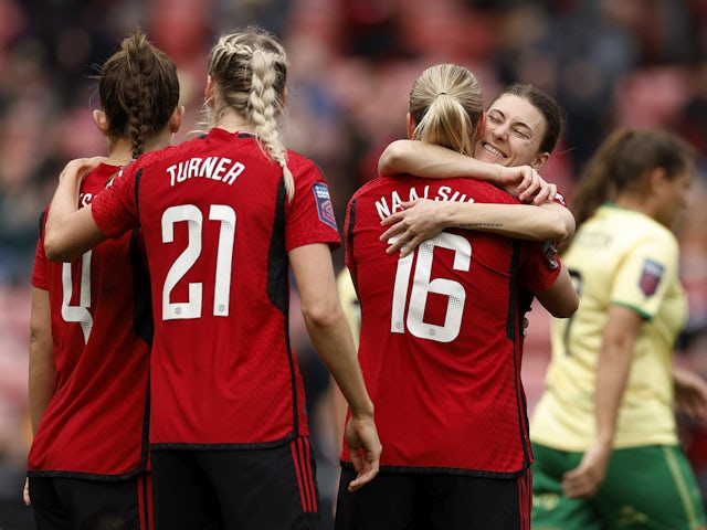 Manchester United Women's Lisa Naalsund celebrates scoring their second goal with Hannah Blundell on March 17, 2024