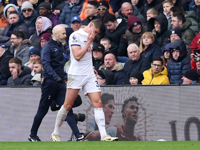 Top Stories Tamfitronics Tottenham Hotspur's Micky van de Ven walks off the pitch after sustaining an anguish on March 10, 2024