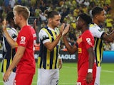 Fenerbahce's Miguel Crespo high fives Nordsjaelland's Mario Dorgeles before the match on September 21, 2023