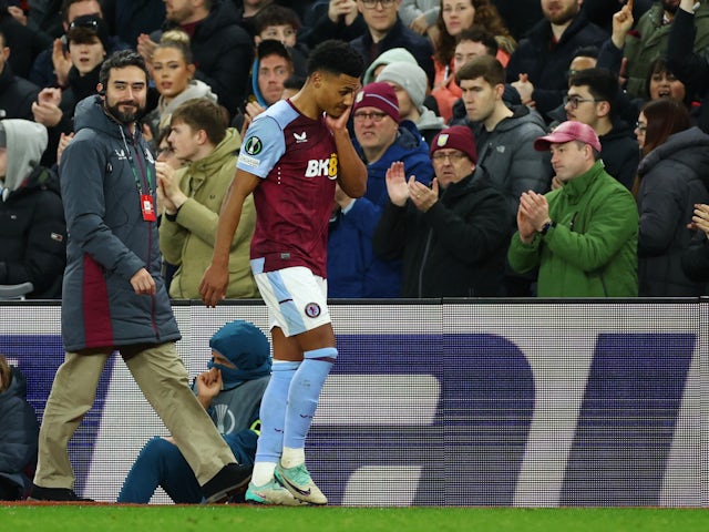 Aston Villa forward Ollie Watkins hobbles off with a knee injury against Ajax on March 14, 2024.