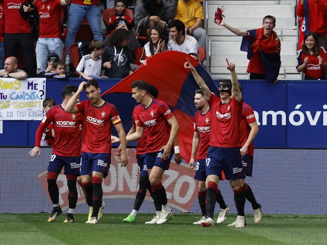 Osasuna's Ante Budimir celebrates scoring their first goal with teammates on March 16, 2024