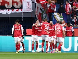Reims' Marshall Munetsi celebrates scoring their first goal with teammates on March 10, 2024