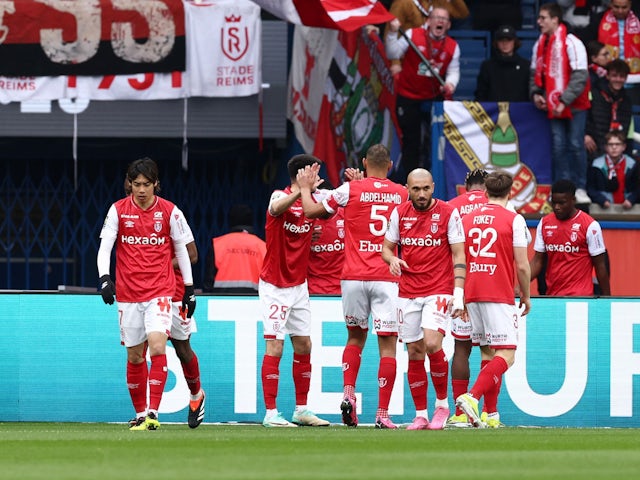 Reims' Marshall Munetsi celebrates scoring their first goal with teammates on March 10, 2024