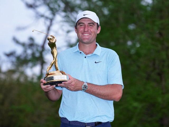 Scottie Scheffler poses with the Players Championship trophy on March 12, 2023