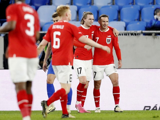 Austria's Andreas Weimann celebrates scoring their second goal with Patrick Wimmer on March 23, 2024