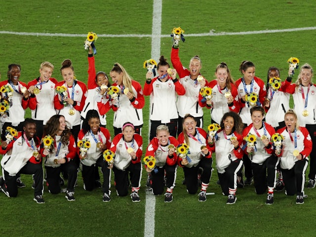 Gold medallists Canada pose during the medal ceremony on August 6, 2021