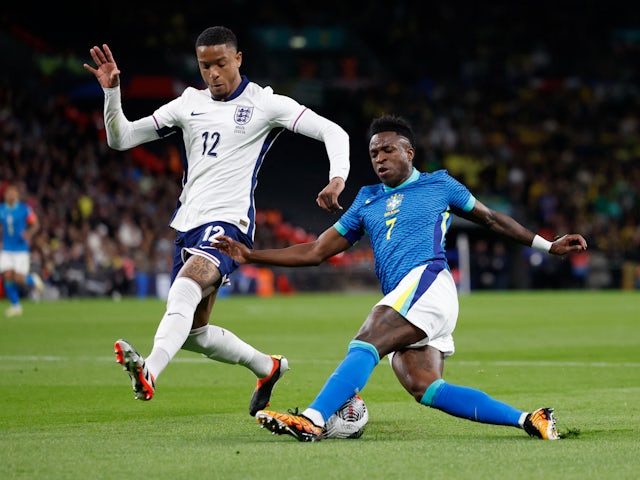 Brazil's Vinicius Junior in action with England's Ezri Konsa on March 23, 2024