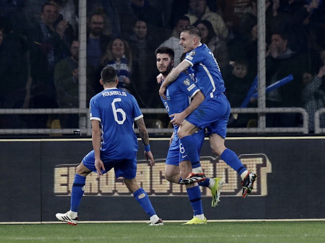 Greece's Fotis Ioannidis celebrates scoring their third goal with teammates on March 21, 2024