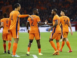 Netherlands' Georginio Wijnaldum celebrates scoring their second goal with Lutsharel Geertruida and Virgil van Dijk on March 22, 2024