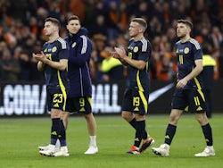 Scotland's Kenny McLean, Lyndon Dykes, Lewis Ferguson and Ryan Christie look dejected after the matc on March 22, 2024