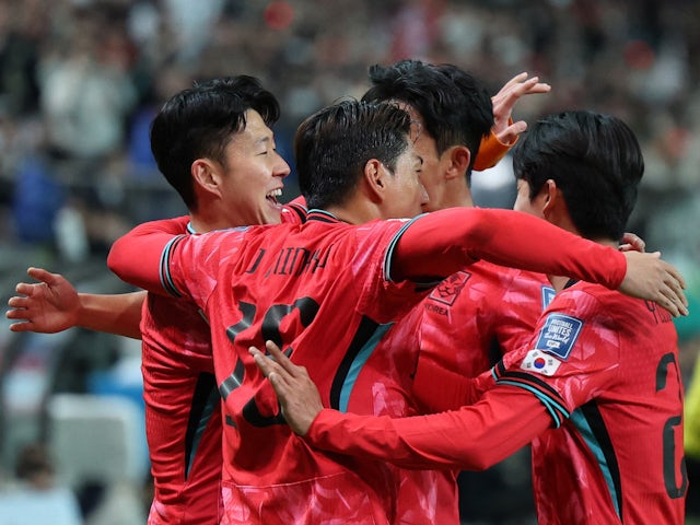 South Korea's Son Heung-min celebrates scoring their first goal with teammates on March 21, 2024