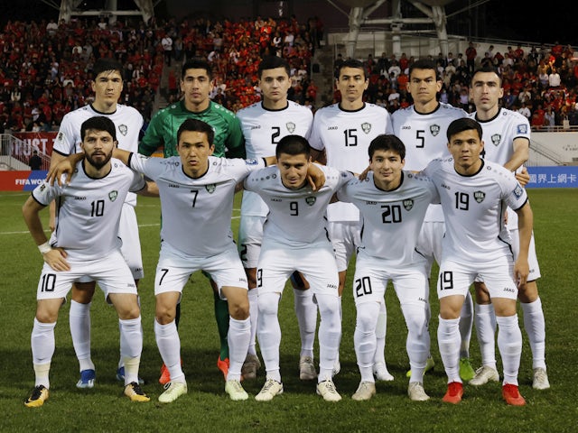 Uzbekistan players pose for a team group photo before the match on March 21, 2024