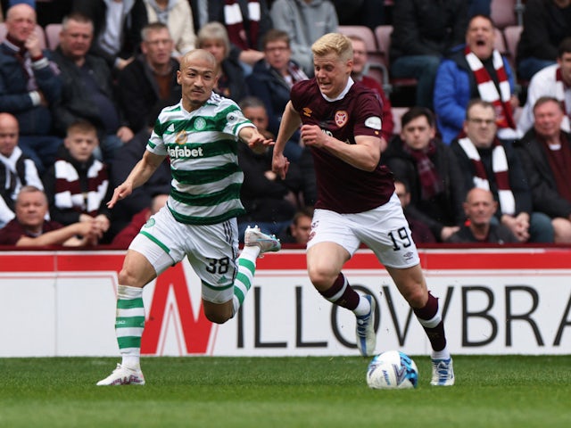 Heart of Midlothian's Alex Cochrane fouls Celtic's Daizen Maeda before being shown a red card on May 7, 2023