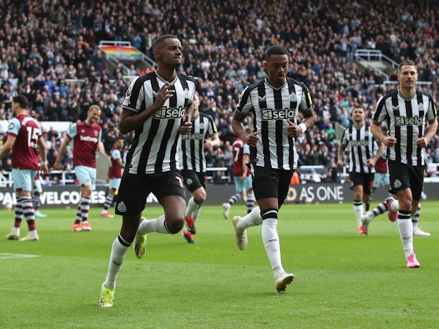 Newcastle United's Alexander Isak celebrates his first goal with Joe Willock on March 30, 2024