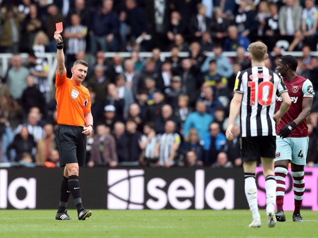 Newcastle United's Anthony Gordon is shown a red card by referee Robert Jones on March 30, 2024