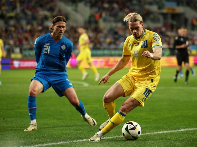 Iceland's Arnor Traustason in action with Ukraine's Mykhaylo Mudryk on March 26, 2024