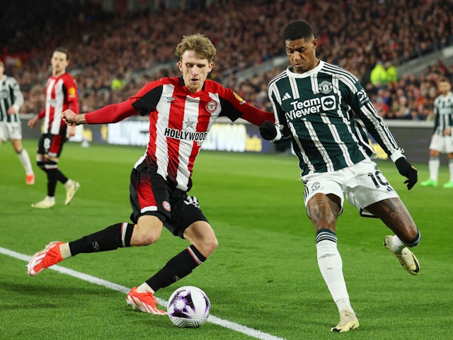 Brentford's Mads Roerslev in action with Manchester United's Marcus Rashford on March 30, 2024
