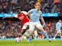 Arsenal's Bukayo Saka in action with Manchester City's Kevin De Bruyne on March 31, 2024
