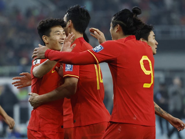 China's Wu Lei celebrates scoring their third goal with teammates on March 26, 2024