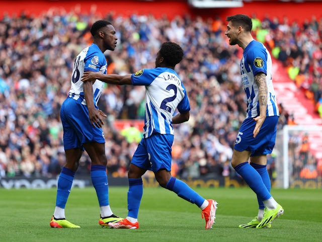 Brighton & Hove Albion's Danny Welbeck celebrates scoring their first goal with Tariq Lamptey and Jakub Moder on March 31, 2024