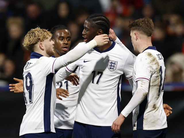 England Under-21s' Samuel Iling-Junior celebrates scoring their second goal with teammates on March 26, 2024