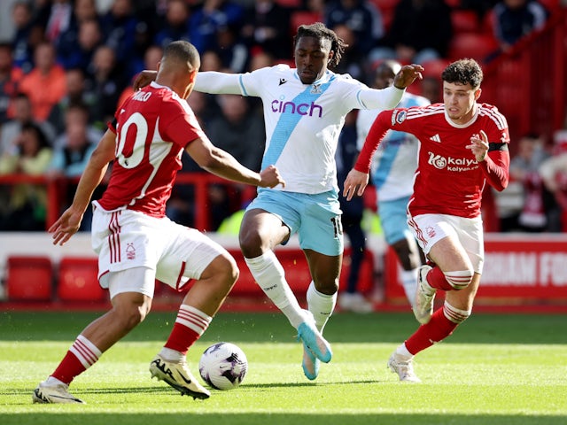 Crystal Palace's Eberechi Eze in action with Nottingham Forest's Murillo and Neco Williams on March 30, 2024