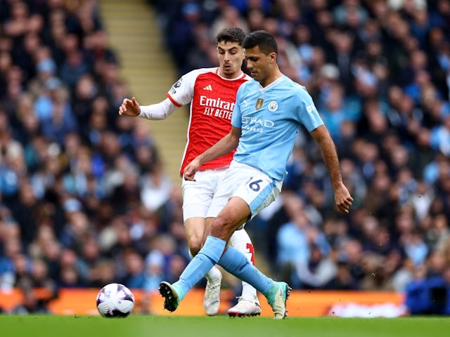Arsenal's Kai Havertz in action with Manchester City's Rodri on March 31, 2024