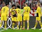 Borussia Dortmund's Karim Adeyemi celebrates scoring their first goal with teammates on March 30, 2024