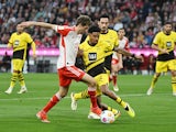 Bayern Munich's Thomas Muller in action with Borussia Dortmund's Ian Maatsen on March 30, 2024