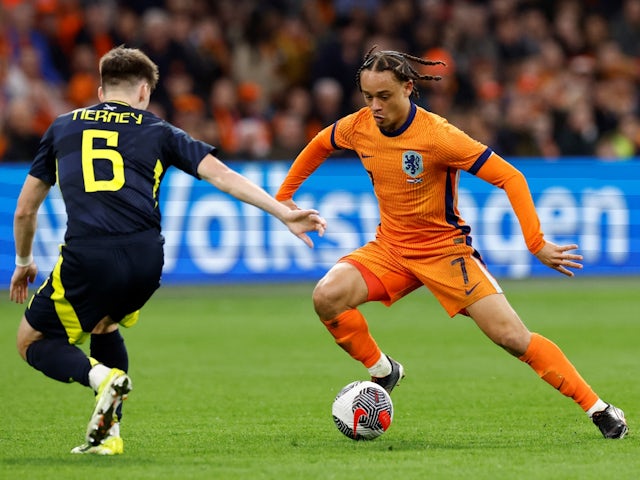 Netherlands' Xavi Simons in action with Scotland's Kieran Tierney on March 22, 2024