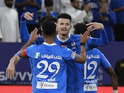 Al Hilal's Salem Al-Dawsari celebrates scoring their third goal with Abdullah Al-Hamdan on April 2, 2024
