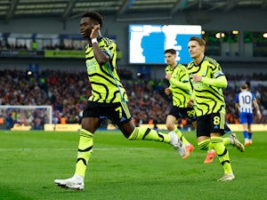Clinical Arsenal return to summit with three-goal Brighton win