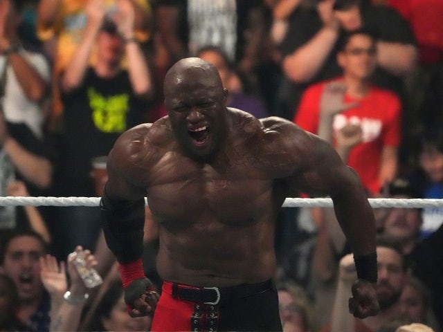 Bobby Lashley (red/black pants) celebrates after defeating Theory (not pictured) in their United State Championship match during Money In The Bank at MGM Grand Garden Arena on July 2, 2022