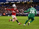 Manchester United's Alejandro Garnacho scores past Chelsea's Djordje Petrovic on April 4, 2024