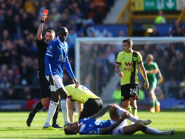 Burnley's Dara O'Shea is shown a red card by referee Michael Oliver on April 6, 2024