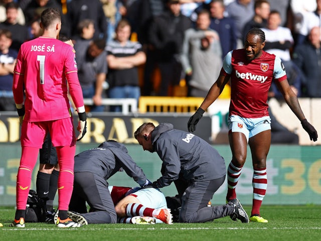 West Ham United's Jarrod Bowen receives medical attention after sustaining an injury on April 6, 2024