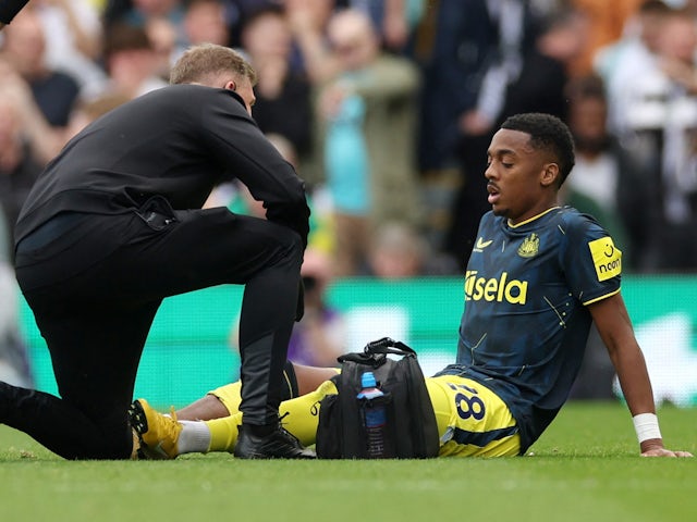 Newcastle United's Joe Willock receives medical attention after sustaining an injury on April 6, 2024