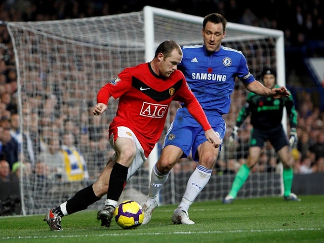 Chelsea's John Terry in action with Manchester United's Wayne Rooney on November 8, 2009.