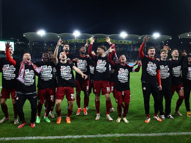 Kaiserslautern's Marlon Ritter and Filip Stojilkovic celebrate with teammates after the match on April 2, 2024