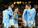 Manchester City's Rodri celebrates scoring their first goal with teammates on April 3, 2024