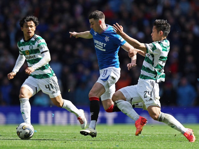 Rangers' Tom Lawrence in action with Celtic's Tomoki Iwata and Reo Hatate on April 7, 2024