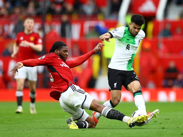 Manchester United's Willy Kambwala in action with Liverpool's Luis Diaz on April 7, 2024