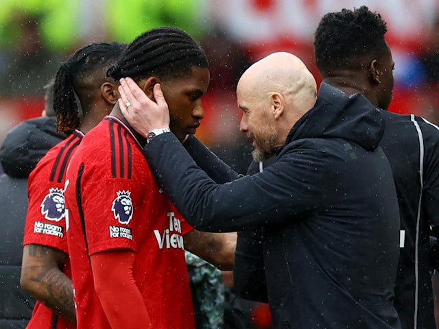 Manchester United's Willy Kambwala with manager Erik ten Hag on April 7, 2024